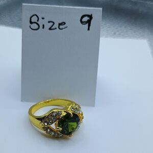 Elegant Gold Ring with Green Gemstone